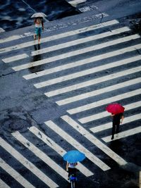 High angle view of people crossing road