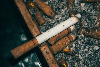 High angle view of cigarette smoking outdoors