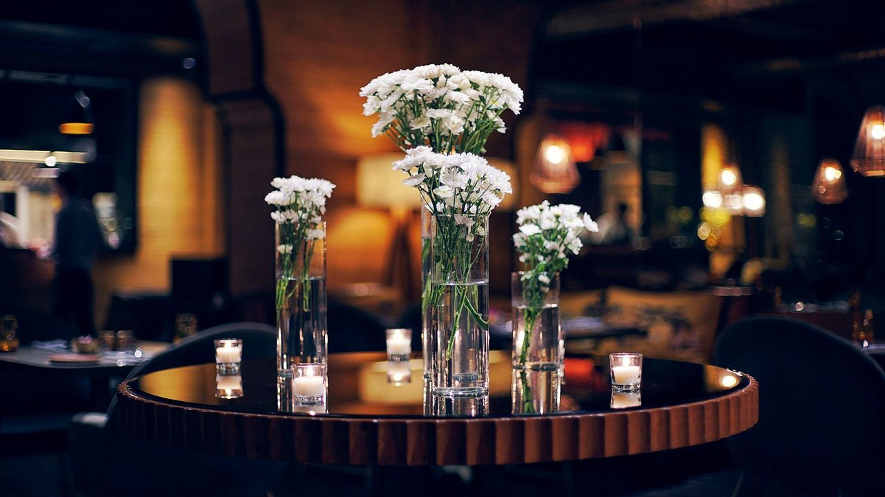 CLOSE-UP OF VASE ON TABLE AT RESTAURANT