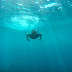 Man swimming in pool