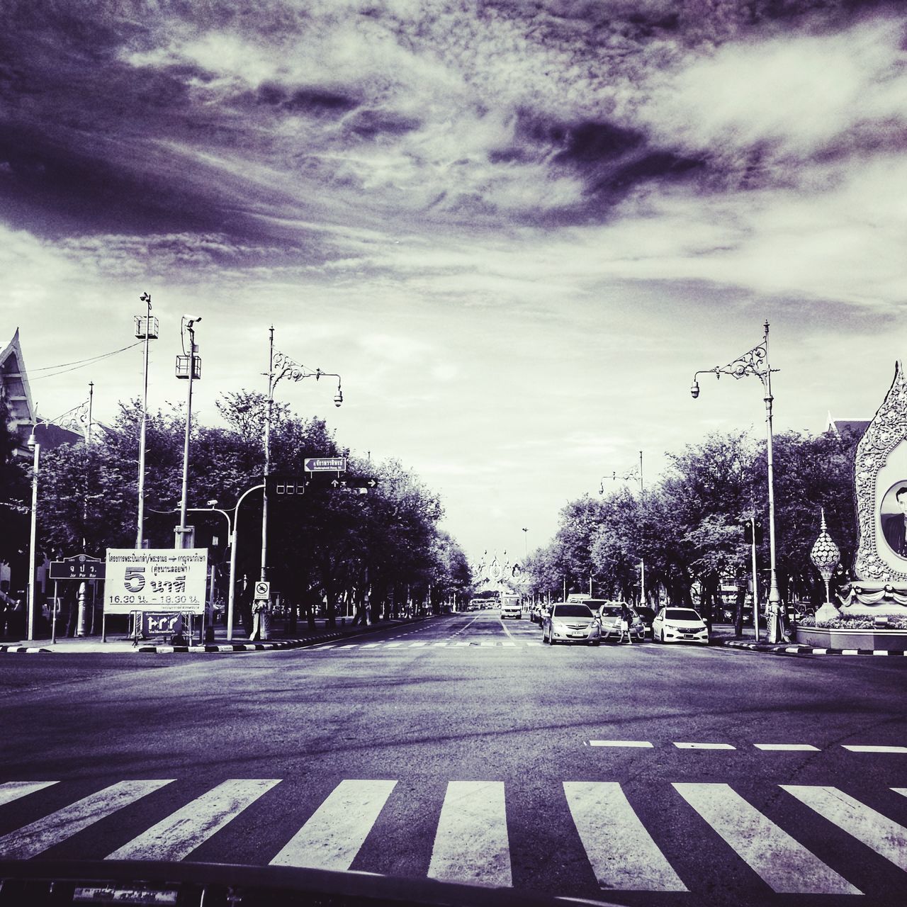 ROAD BY STREET AGAINST SKY