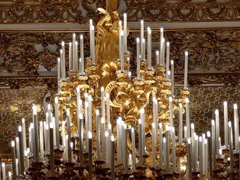 Low angle view of illuminated chandelier in building