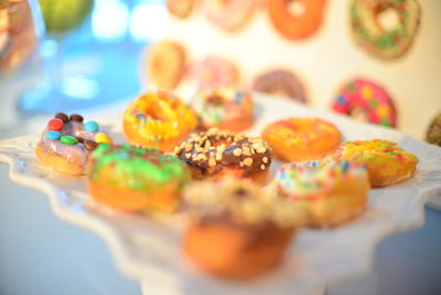 Close-up of colored donuts in plate