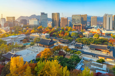 High angle view of buildings in city against sky