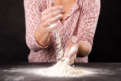 Cropped hand of man preparing food