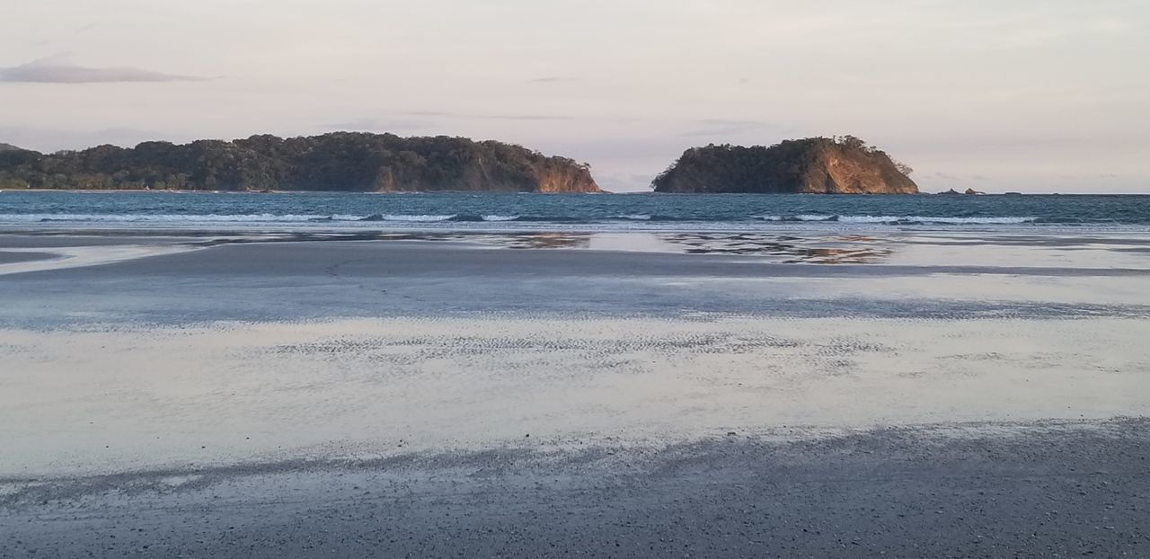 SCENIC VIEW OF BEACH AND SEA AGAINST SKY