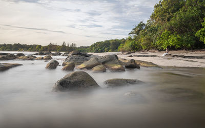 Long exposure capture of coast and ocean on borneo, sabah - malaysia
