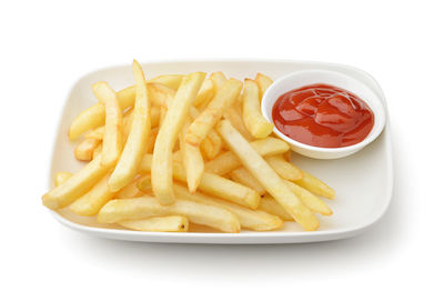 Close-up of noodles with fries and rice in plate