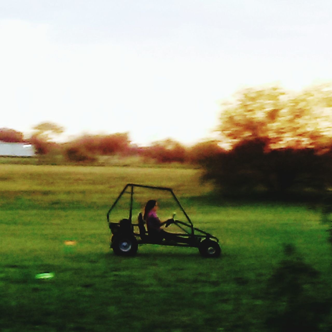 MAN CYCLING ON GOLF COURSE