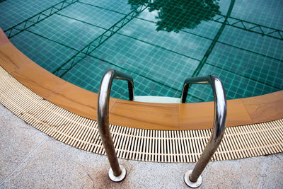 High angle view of ladder at swimming pool
