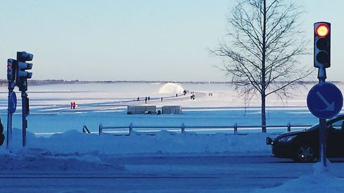 Scenic view of sea against clear sky during winter