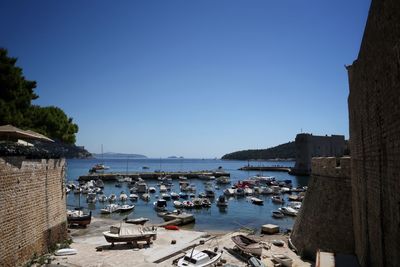 High angle view of boats moored in harbor