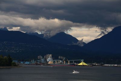 View of town against cloudy sky