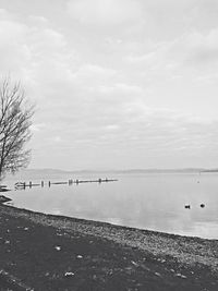 Scenic view of sea against cloudy sky