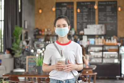 Portrait of man holding ice cream