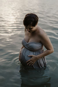 Woman standing in lake