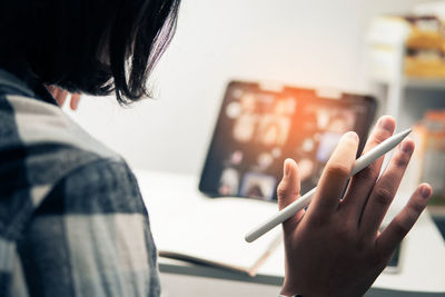 Midsection of woman using smart phone