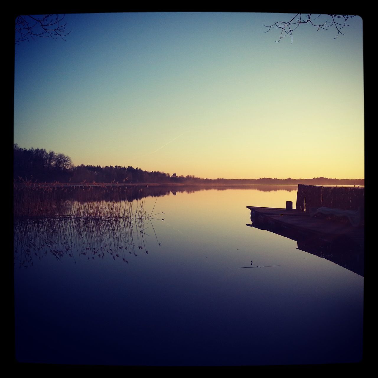 water, reflection, transfer print, tranquil scene, lake, tranquility, scenics, sunset, auto post production filter, clear sky, beauty in nature, copy space, nature, waterfront, standing water, calm, sky, idyllic, silhouette, dusk