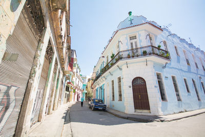 Street amidst buildings against sky