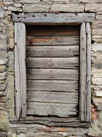 Close-up of old wooden door of building