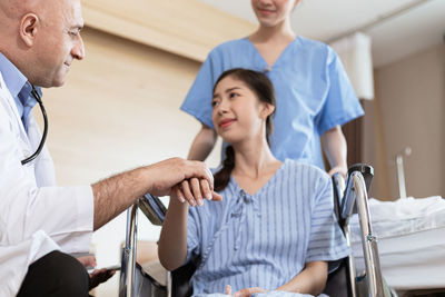 Portrait of doctor examining patient