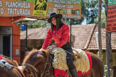 Full length of man riding hat