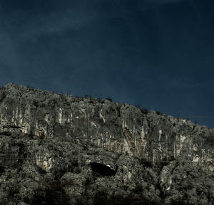 Rock formations on mountain against sky