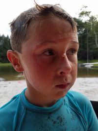 Close-up portrait of boy looking away