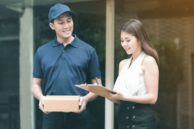 Portrait of a smiling young man working