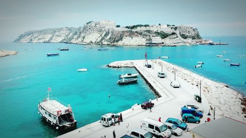 High angle view of boats moored at harbor