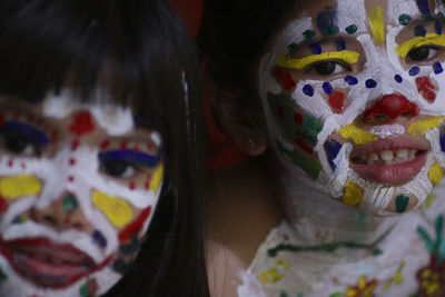 Close-up of girls with painted faces