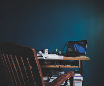 Person using laptop on table at night