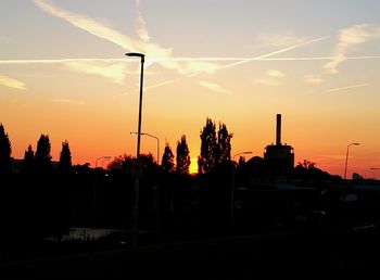 Silhouette of trees against sky at sunset