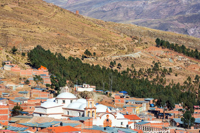 High angle view of church in town against mountains