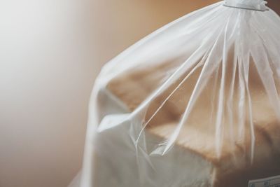 Cropped image of bread slices in plastic bag