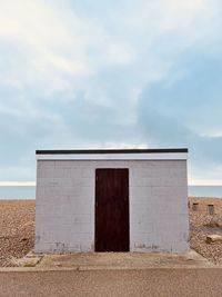 Fishing boat winch housing on shingle beach