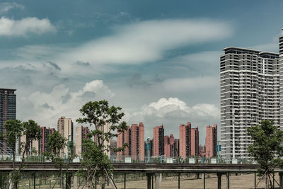 Buildings in city against sky