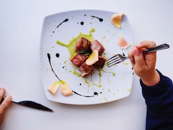 Cropped image of person holding breakfast