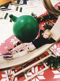 High angle portrait of boy on table