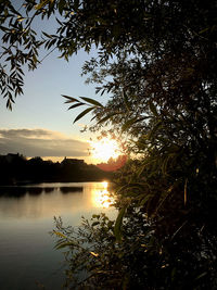 Scenic view of lake against sky during sunset