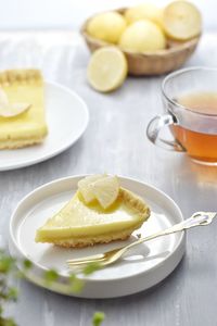 Milky pie on white plate, soft focus