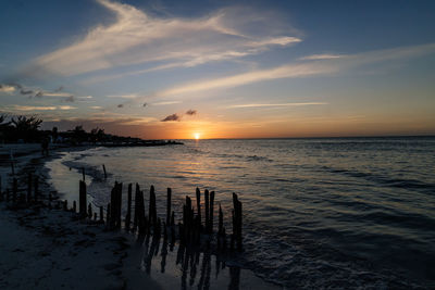 Sunset on main beach of isla holbox in mexico.