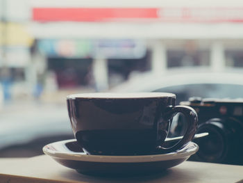 Close-up of coffee cup on table