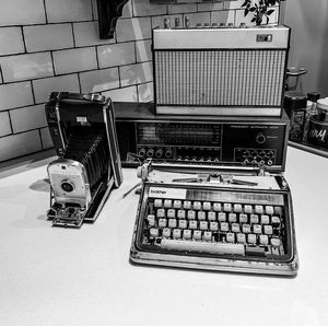 Close-up of old machine part on table