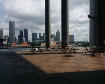 Buildings against cloudy sky