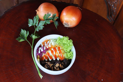 High angle view of fruits in bowl on table