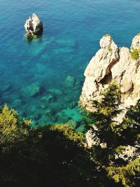 High angle view of rock formation in sea