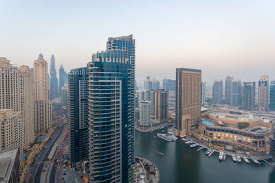 High angle view of buildings against sky in city