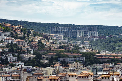 High angle view of buildings in city against sky