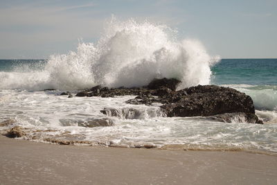 Waves splashing on rocks